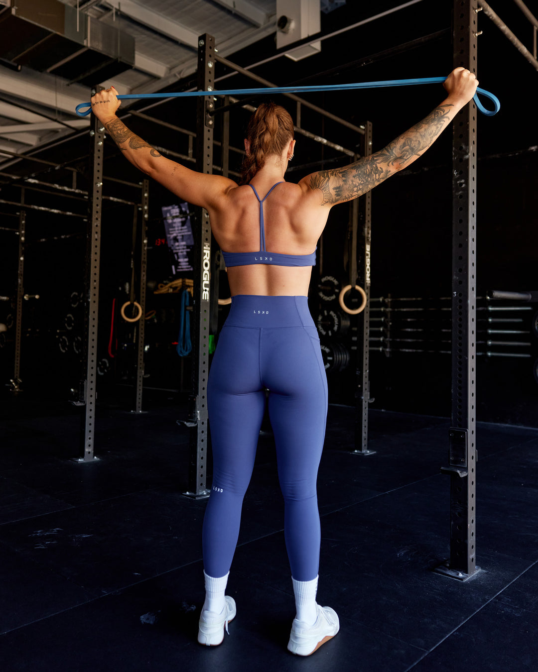 Woman wearing Progression Sports Bra - Future Dusk - view 1