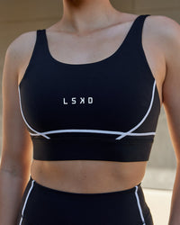 Woman wearing Pulse Sports Bra - Black | Thumbnail Index: 3