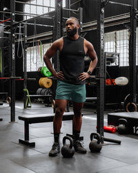 Man wearing Rep 5" Performance Shorts - Sage Bush | Thumbnail Index: 1