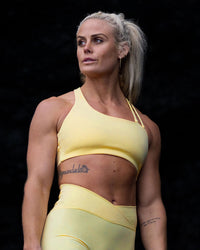 Woman wearing Sara Helios Sports Bra - Sunflower | Thumbnail Index: 0