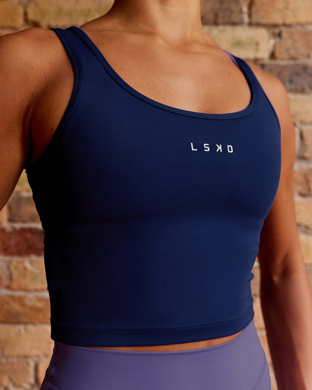 Woman wearing Staple Active Cropped Tank - Midnight Blue - view 3