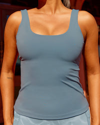 Woman wearing Staple Active Shelf Bra Tank - Elemental Blue | Thumbnail Index: 1