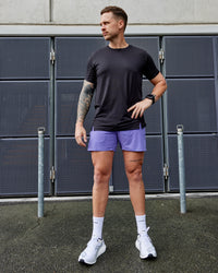 Man wearing UltraAir 5" Lined Performance Shorts - Dahlia Purple | Thumbnail Index: 4