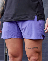 Man wearing UltraAir 5" Lined Performance Shorts - Dahlia Purple | Thumbnail Index: 1