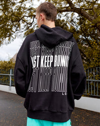 Man wearing Unisex Keep on Running Hoodie Oversize - Black-White | Thumbnail Index: 1