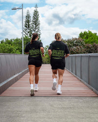 Duo wearing Unisex Leg It FLXCotton Tee Oversize - Black-Volt | Thumbnail Index: 0