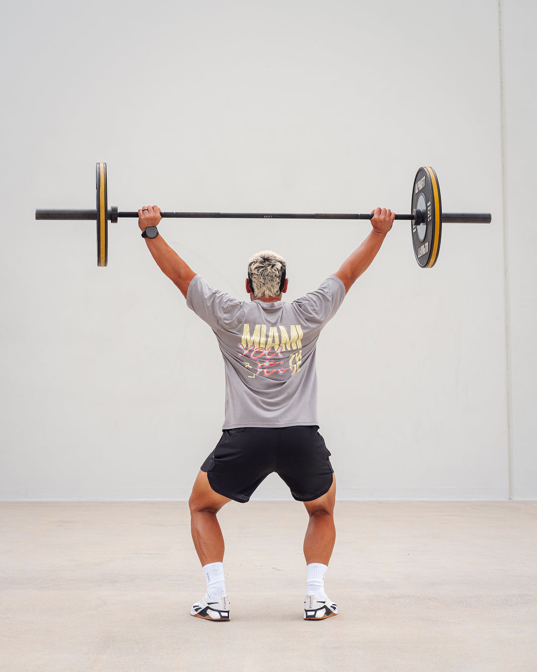 Man wearing Unisex Miami25 Washed FLXCotton Tee Oversize - Storm Front-Lemon Fizz - view 2