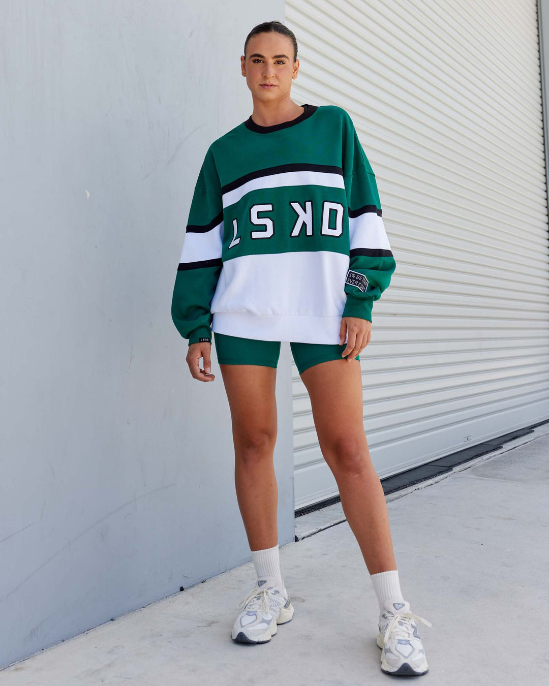Woman wearing Unisex PrimeTime Sweater Oversize - Malachite-White - view 2