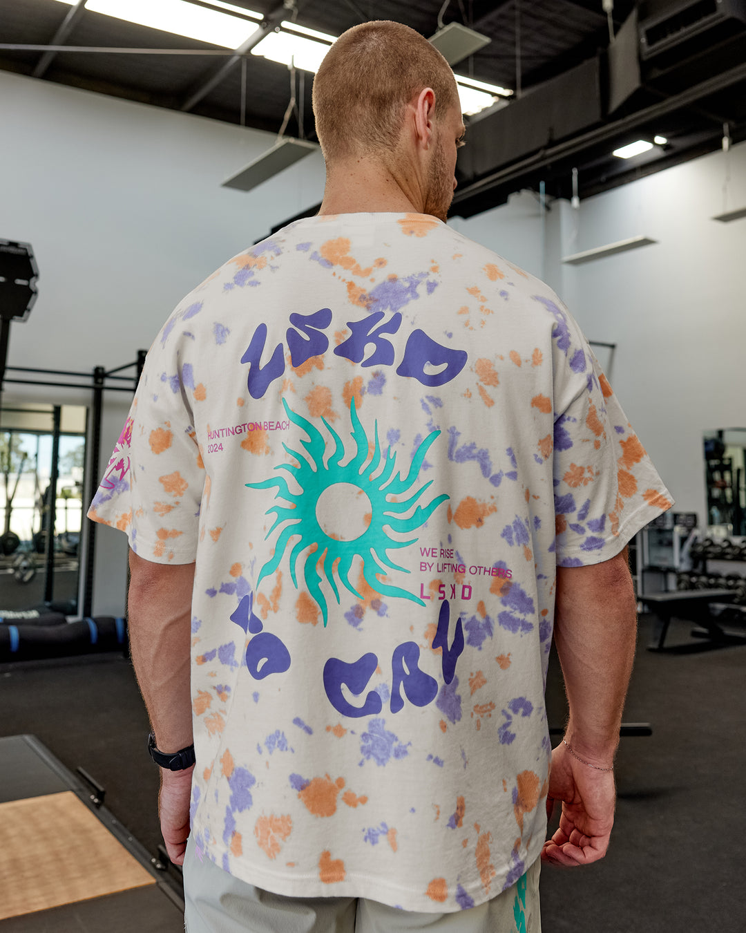 Man wearing Unisex Washed Huntington 24 Heavyweight Tee Oversize - Tie Dye Tangerine-Dahlia Purple - view 2
