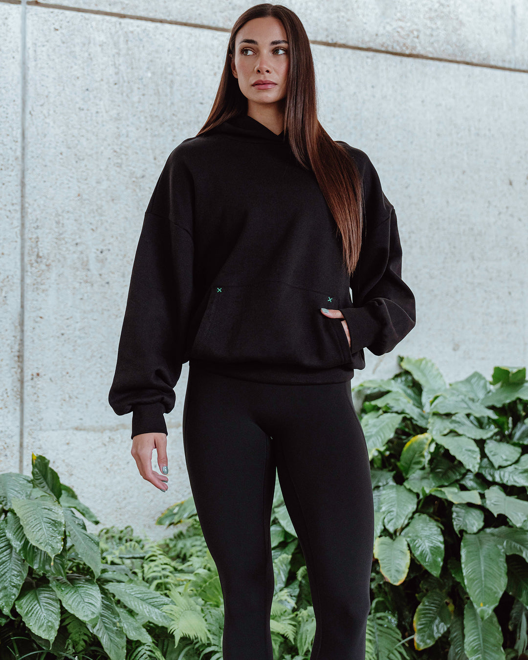 Woman wearing Unisex We Rise Hoodie Oversize - Black-Impact Green - view 2