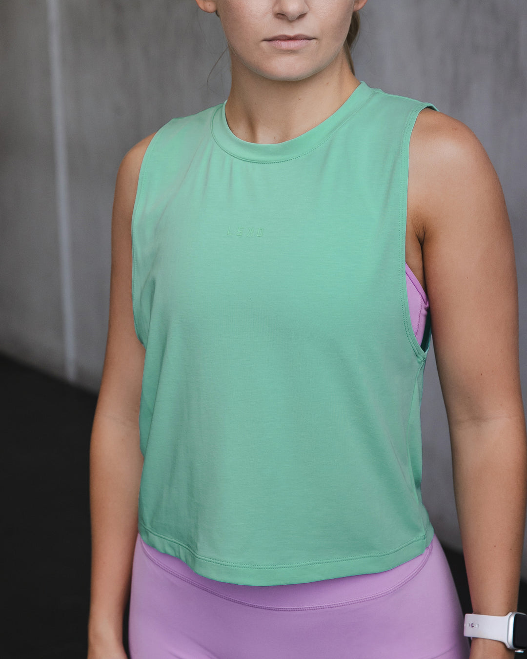 Woman wearing Vital Cropped Training Tank - Cockatoo - view 1