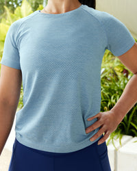 Woman wearing AeroFLX+ Seamless Tee - Elemental Blue/Ice Blue | Thumbnail Index: 0