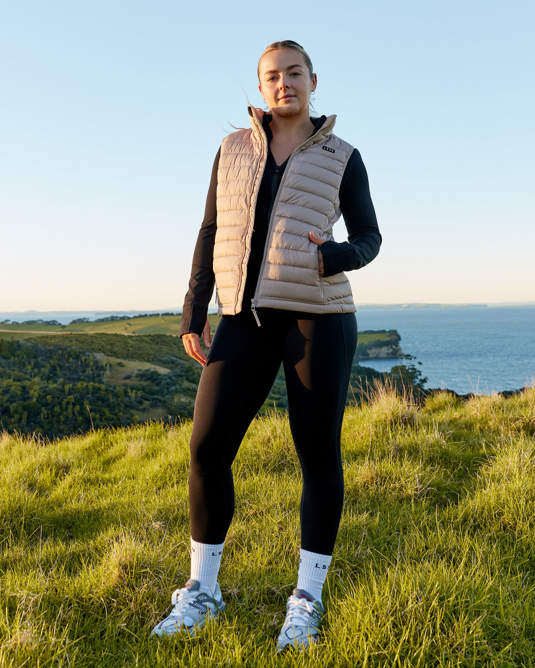 Woman wearing All Day Puffer Vest - Desert - view 1