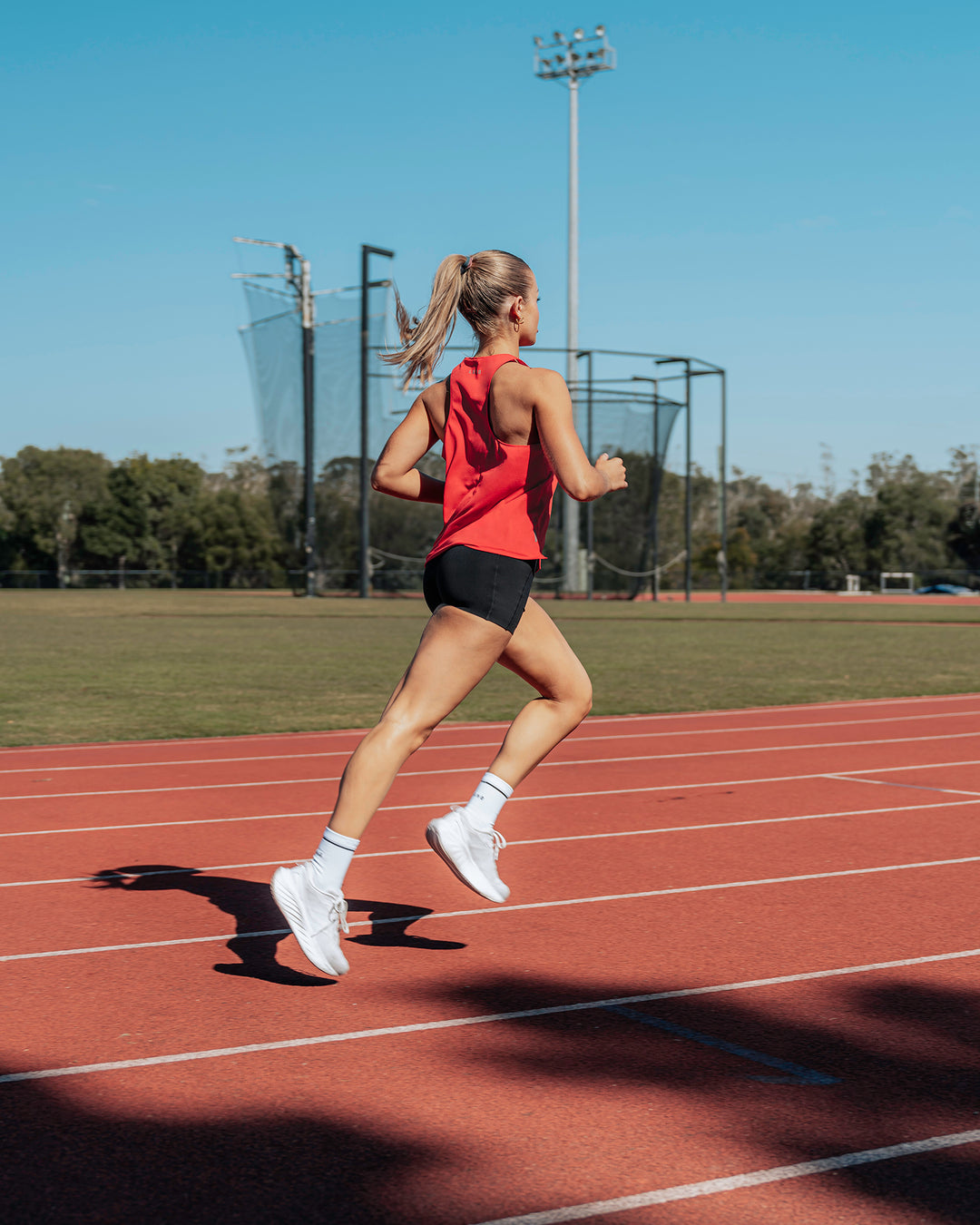 Woman wearing Pace Running Tank - Scarlet - view 2