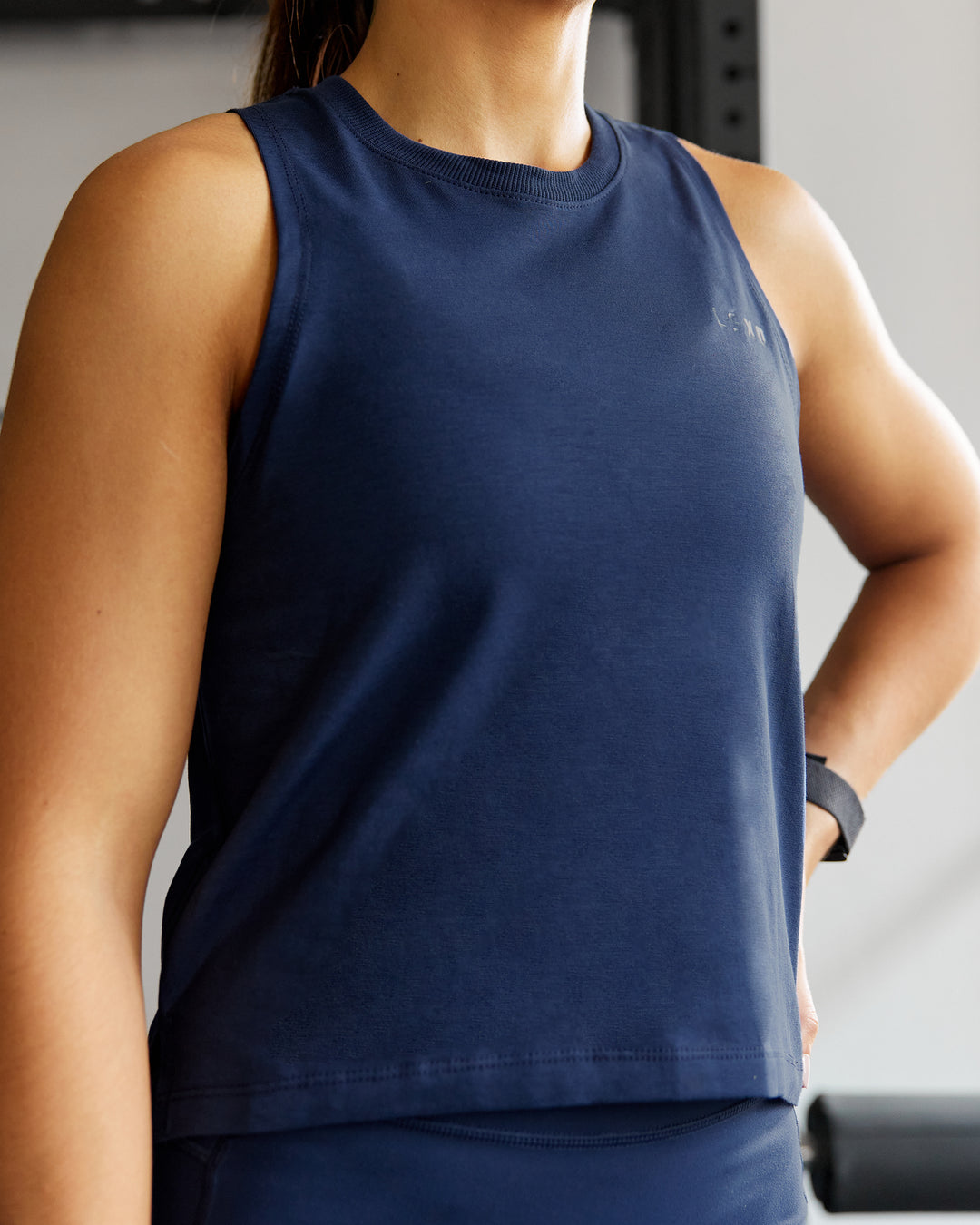 Woman wearing Deluxe PimaFLX Tank - Future Navy - view 1