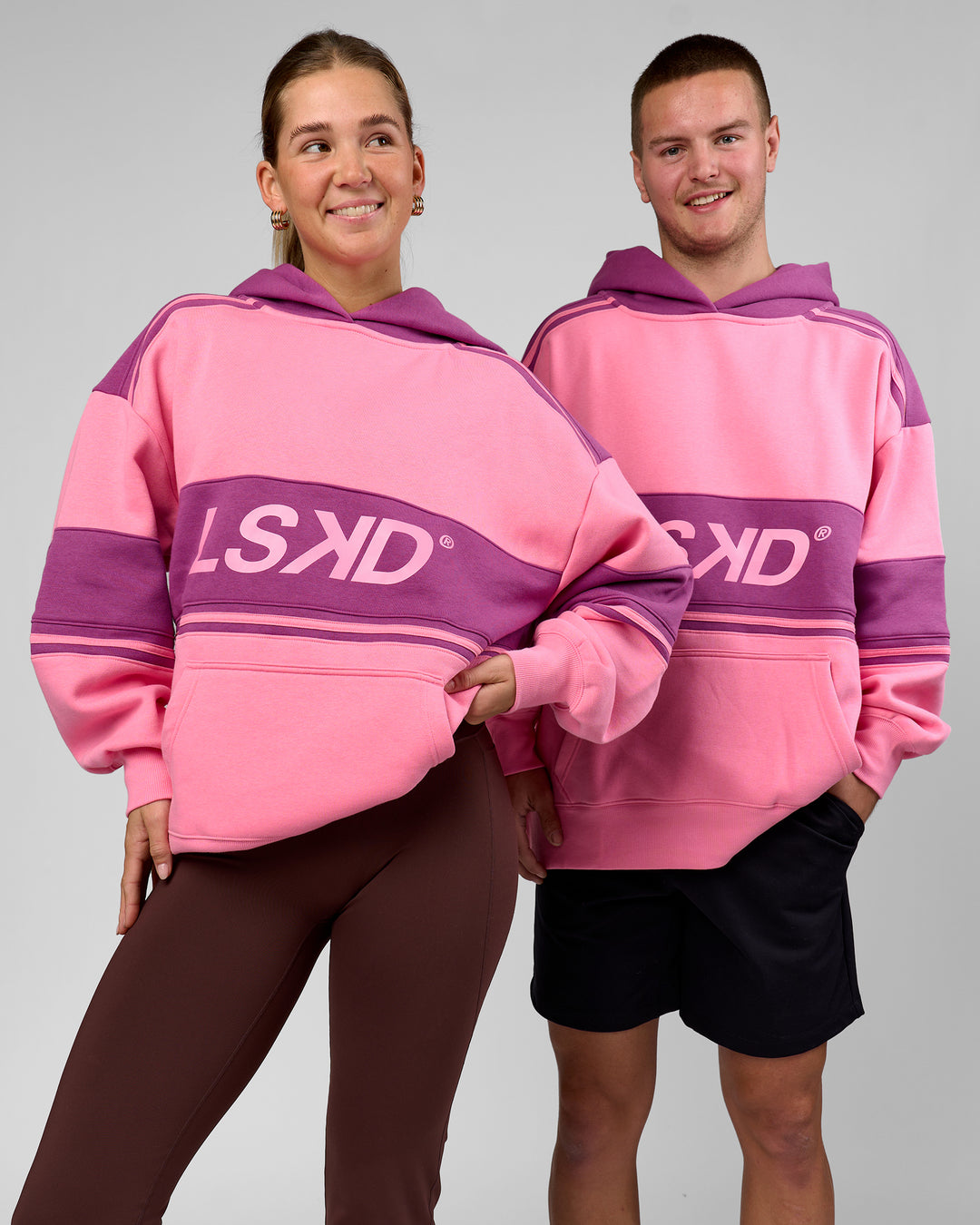 Duo wearing A-Team Oversized Hoodie - Candy Pink-Boysenberry | Model:Amity | Size:S | Model:Arran | Size:M - view 1
