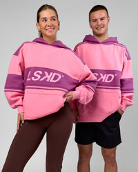 Duo wearing A-Team Oversized Hoodie - Candy Pink-Boysenberry | Model:Amity | Size:S | Model:Arran | Size:M | Thumbnail Index: 0