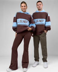 Duo wearing A-Team Oversized Hoodie - Hot Chocolate-Open Air | Model:Amity | Size:XS | Model:Arran | Size:M | Thumbnail Index: 1