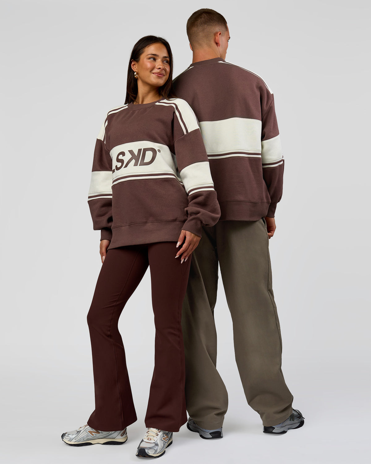 Duo wearing A-Team Sweater Oversize in Cocoa Powder-Off White | Model:Bianca | Size:XS | Model:Albert | Size: M