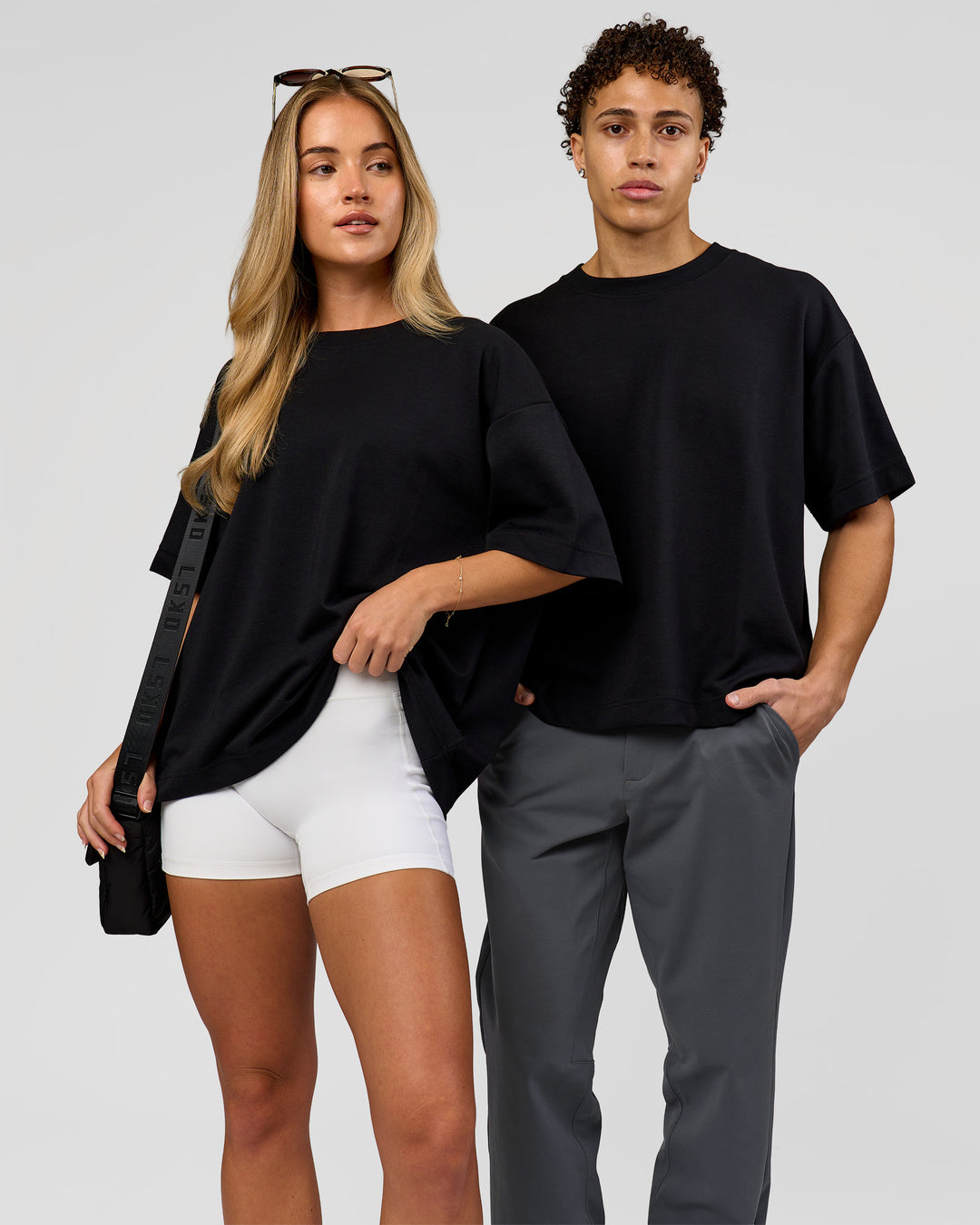 Duo wearing AfterDark ZeroCrease Boxy Tee in Black | Model:Issy | Size:XS | Model:Leandro | Size:M - view 6