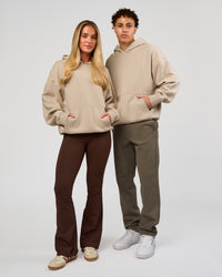 Duo wearing Base Oversized Hoodie - Shale Beige | Model:Leandro | Size:M | Model:Issy | Size: XS | | Thumbnail Index: 10