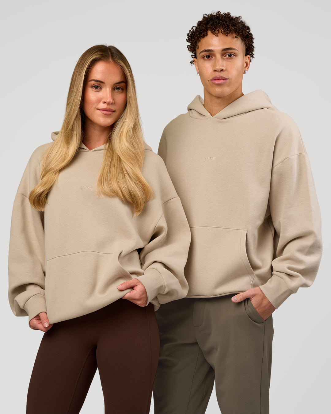 Duo wearing Base Oversized Hoodie - Shale Beige | Model:Leandro | Size:M | Model:Issy | Size: XS | - view 3