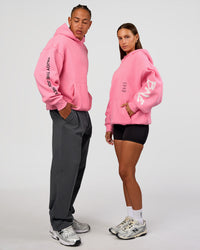 Duo wearing CFT BNE 26 Unisex Oversized Hoodie - Candy Pink-Black | Model:Brylee | Size:XS | Model:Malebo | Size:M | Thumbnail Index: 0
