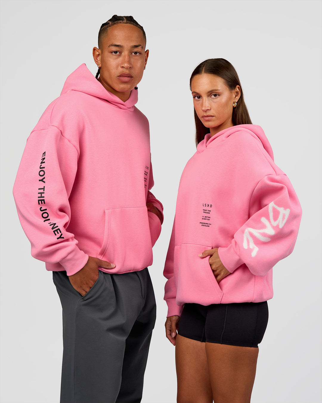 Duo wearing CFT BNE 26 Unisex Oversized Hoodie - Candy Pink-Black | Model:Brylee | Size:XS | Model:Malebo | Size:M - view 6