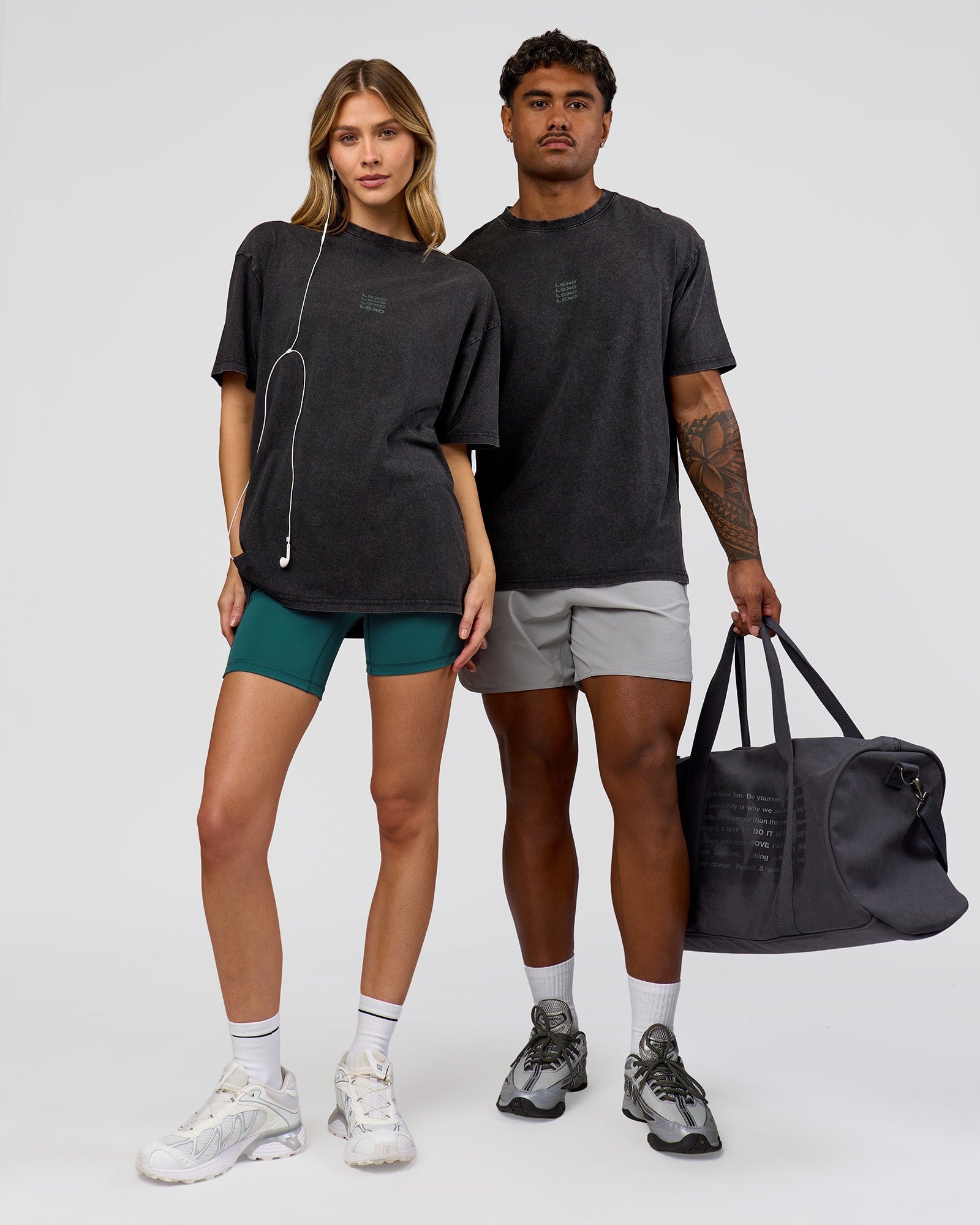 Duo wearing Everyday Elevation FLXCotton Oversized Tee - Black Washed-Carbon Green | Model:Leilani | Size:XS | Model:Xav | Size:L