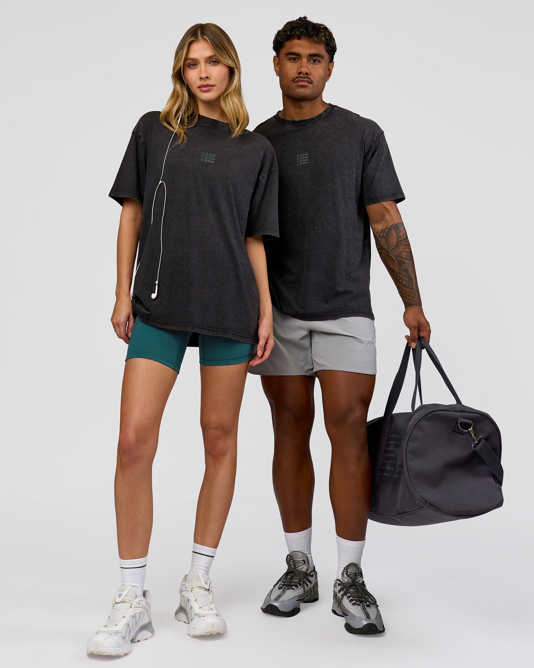 Duo wearing Everyday Elevation FLXCotton Oversized Tee - Black Washed-Carbon Green | Model:Leilani | Size:XS | Model:Xav | Size:L - view 5