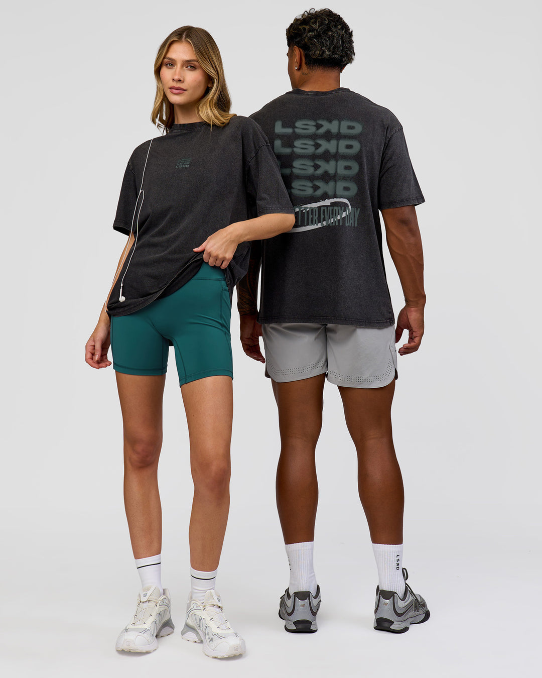 Duo wearing Everyday Elevation FLXCotton Oversized Tee - Black Washed-Carbon Green | Model:Leilani | Size:XS | Model:Xav | Size:L - view 2