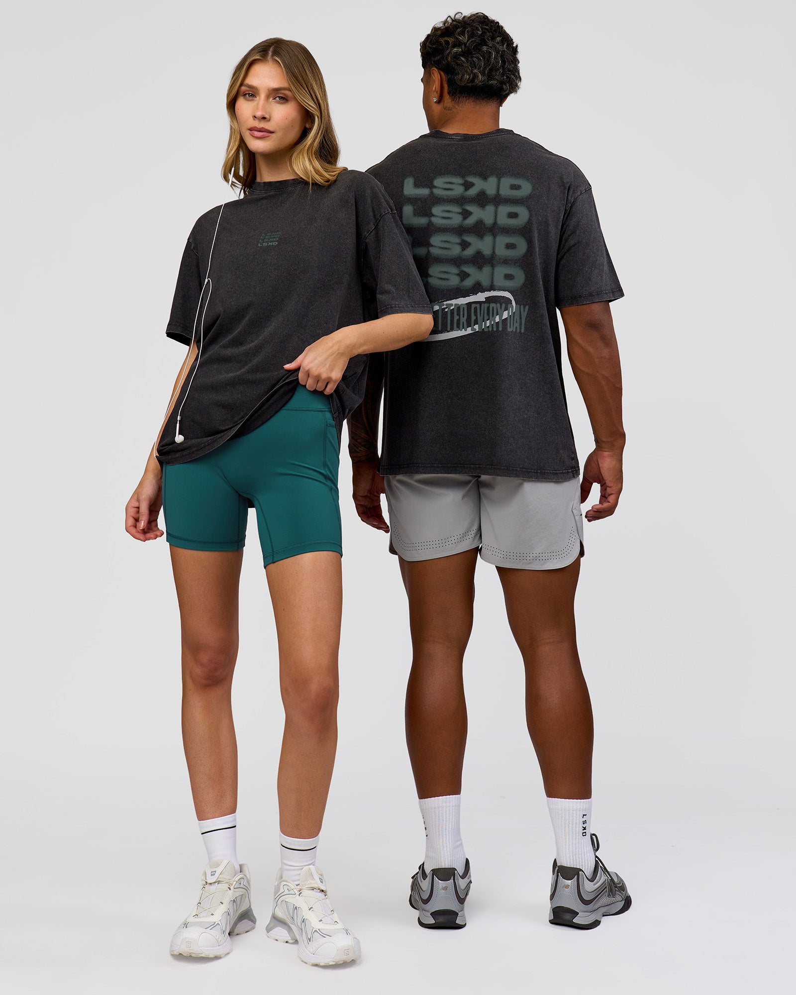 Duo wearing Everyday Elevation FLXCotton Oversized Tee - Black Washed-Carbon Green | Model:Leilani | Size:XS | Model:Xav | Size:L