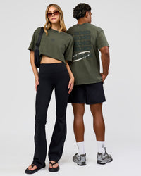 Duo wearing Everyday Elevation FLXCotton Oversized Tee - Carbon Green Washed -White | Model:Leilani | Size:XS | Model:Xav | Size:L | Thumbnail Index: 0