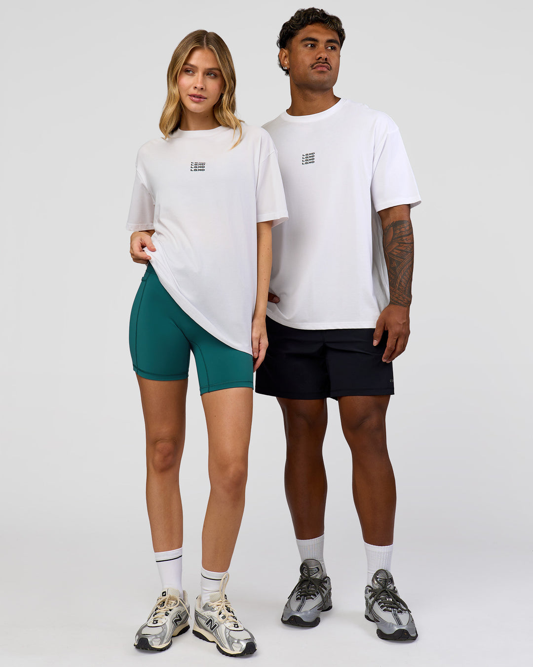 Duo wearing Everyday Elevation FLXCotton Oversized Tee - White-Carbon Green | Model:Leilani | Size:XS | Model:Xav | Size:L - view 2