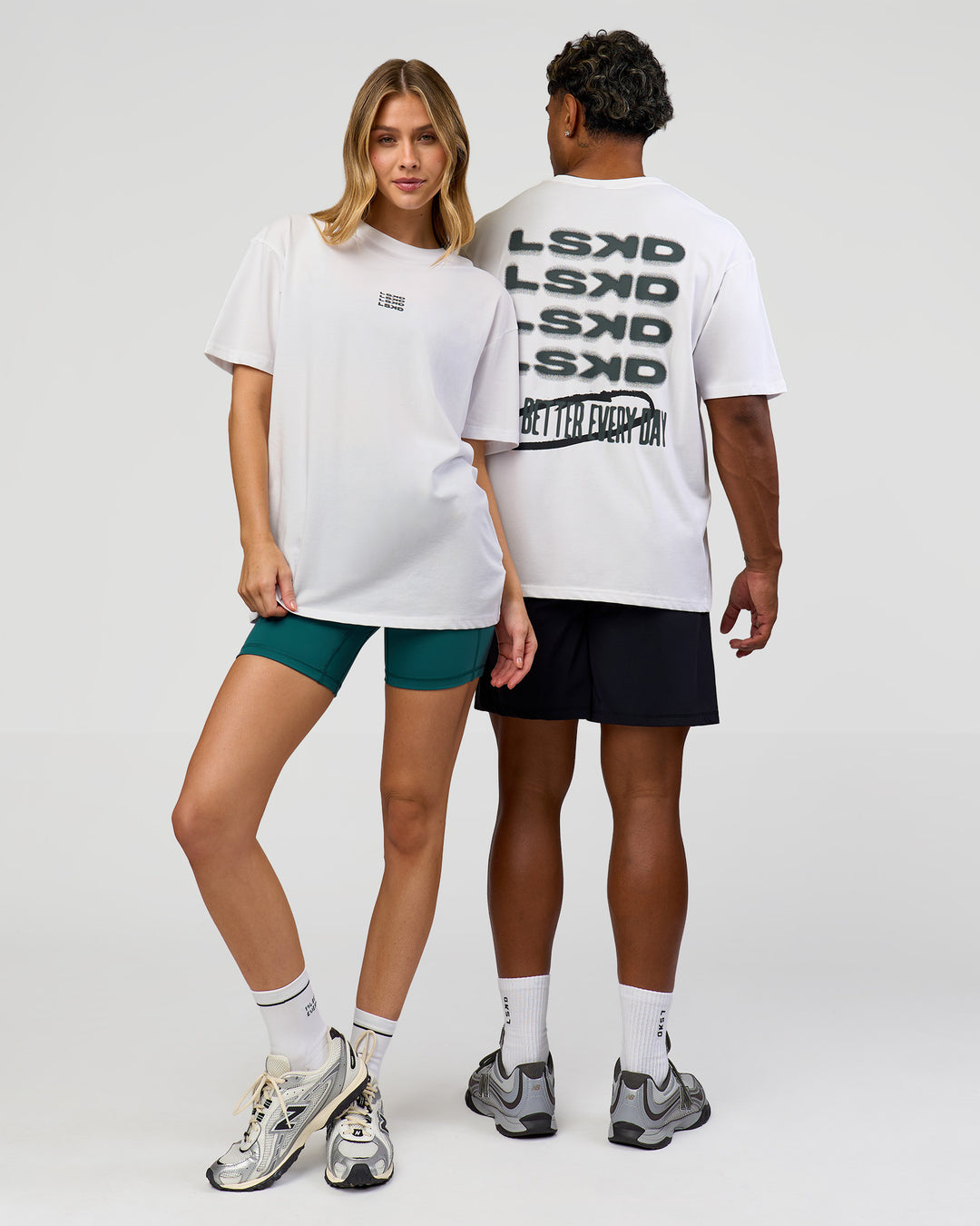 Duo wearing Everyday Elevation FLXCotton Oversized Tee - White-Carbon Green | Model:Leilani | Size:XS | Model:Xav | Size:L - view 7
