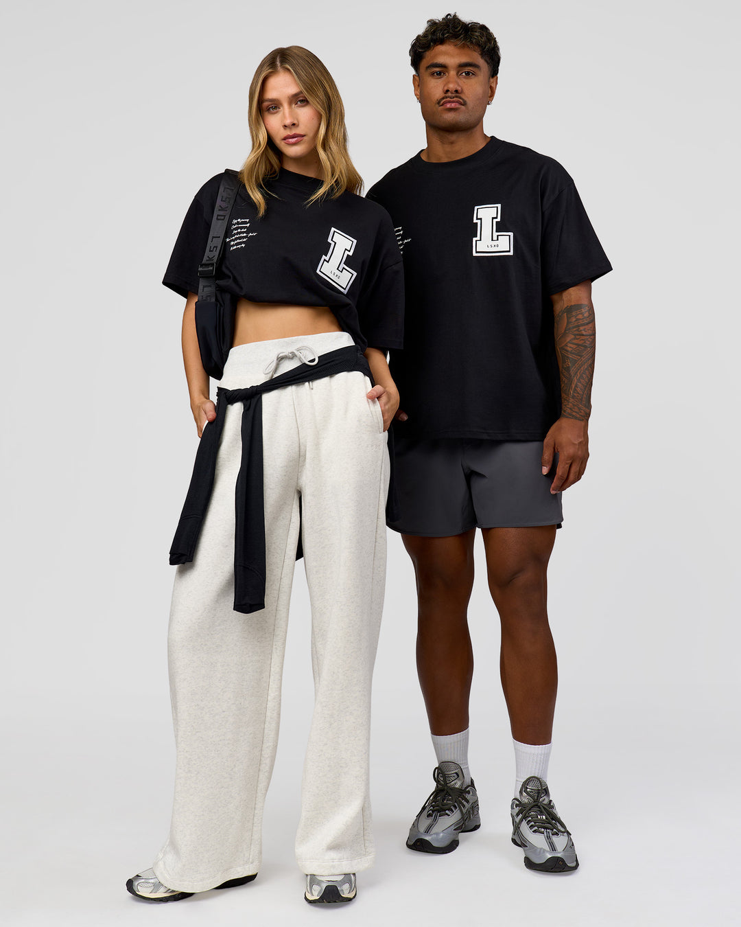 Duo wearing Hype Heavyweight Unisex Oversized Tee - Black-White | Model:Leilani | Size:XS | Model:Xavier | Size:L - view 1