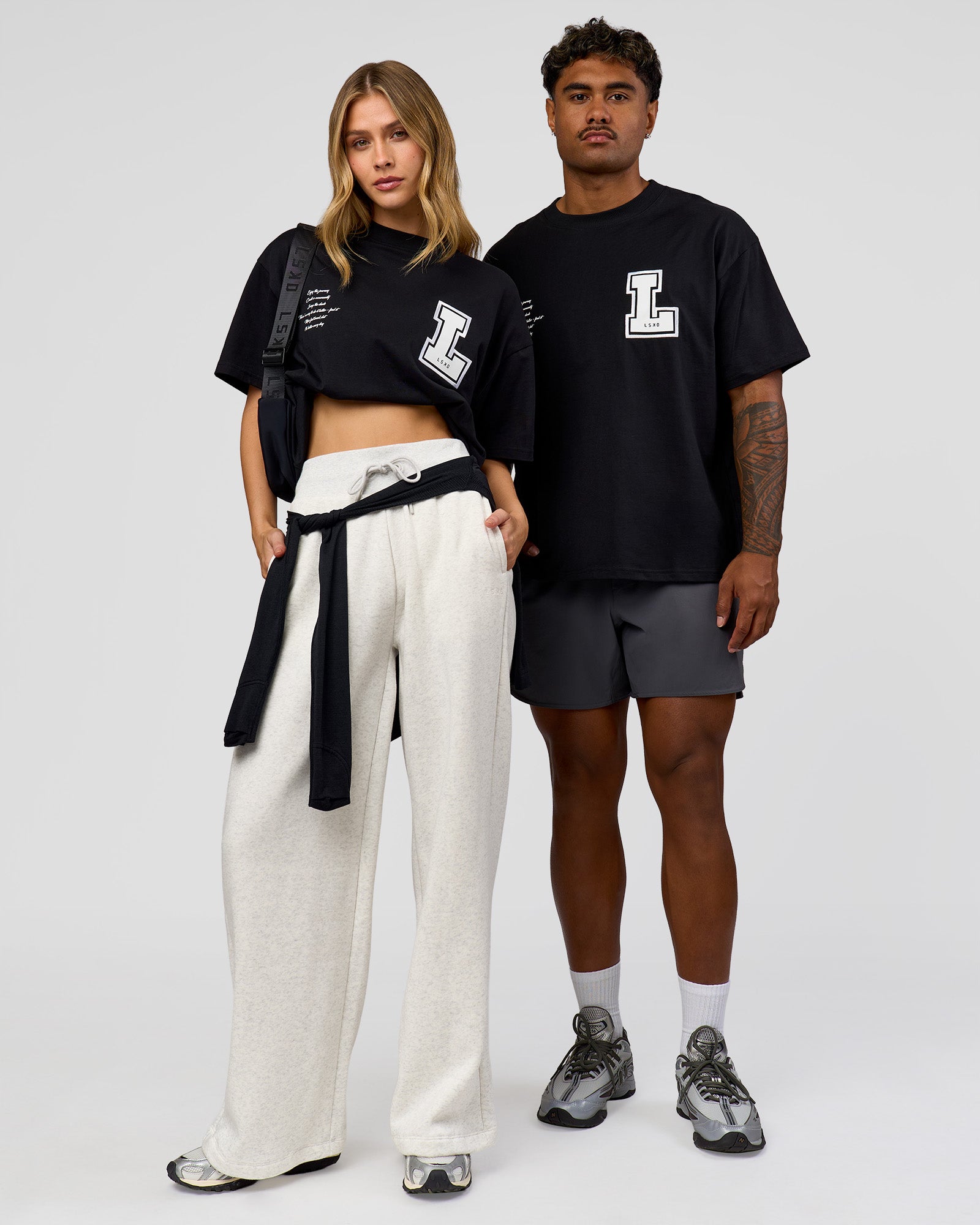 Duo wearing Hype Heavyweight Unisex Oversized Tee - Black-White | Model:Leilani | Size:XS | Model:Xavier | Size:L