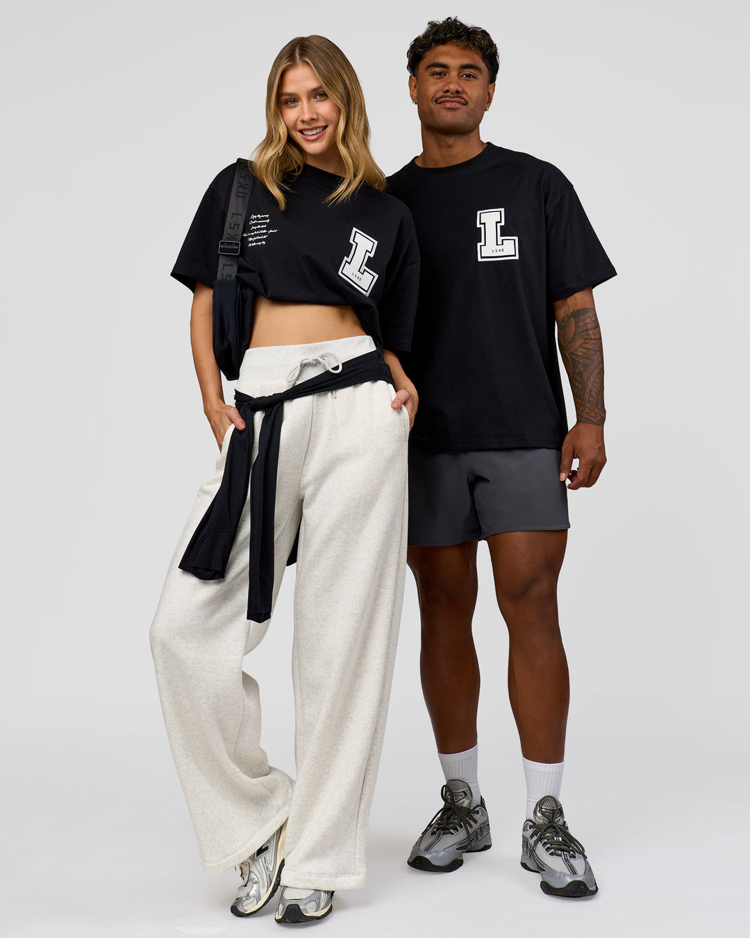 Duo wearing Hype Heavyweight Unisex Oversized Tee - Black-White | Model:Leilani | Size:XS | Model:Xavier | Size:L - view 2