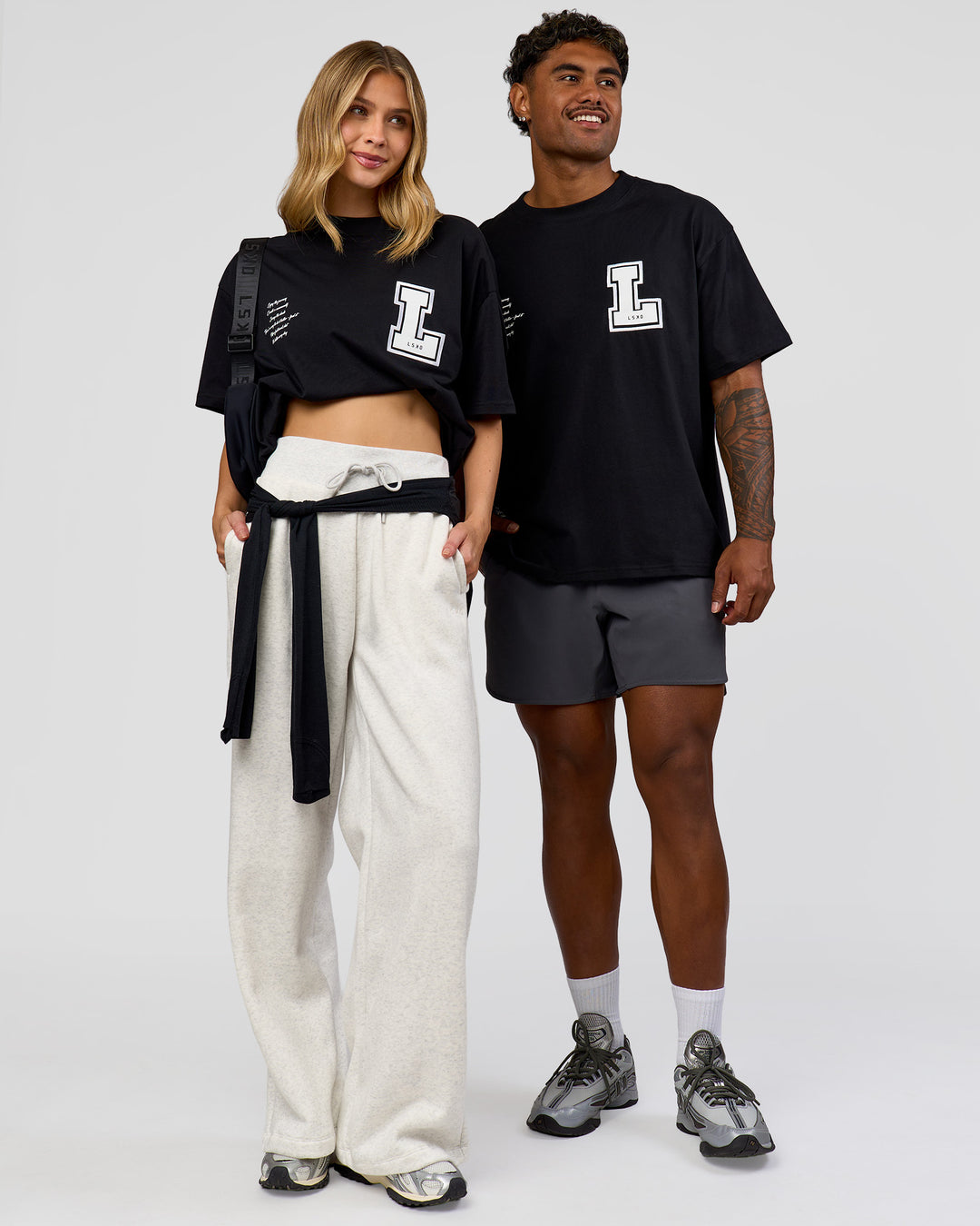 Duo wearing Hype Heavyweight Unisex Oversized Tee - Black-White | Model:Leilani | Size:XS | Model:Xavier | Size:L - view 3