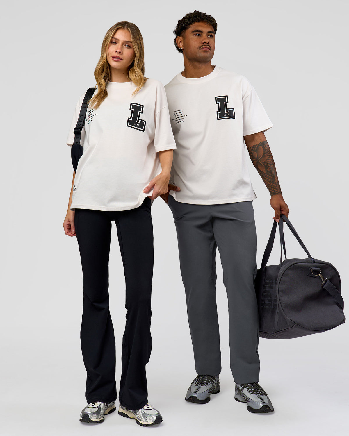 Duo wearing Hype Heavyweight Unisex Oversized Tee - Off White-Black | Model:Xavier | Size:L | Model:Brylee | Size:XS