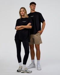 Duo wearing 1% Better Every Day EST FLXCotton Oversized Tee - Black | Model:Both | Size:Duo | Thumbnail Index: 0