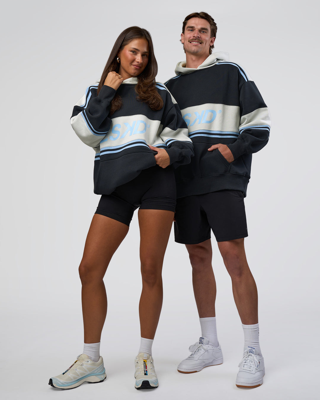 Duo wearing A-Team Oversized Hoodie - Caviar-Open Air | Model:Both | Size:Duo - view 1