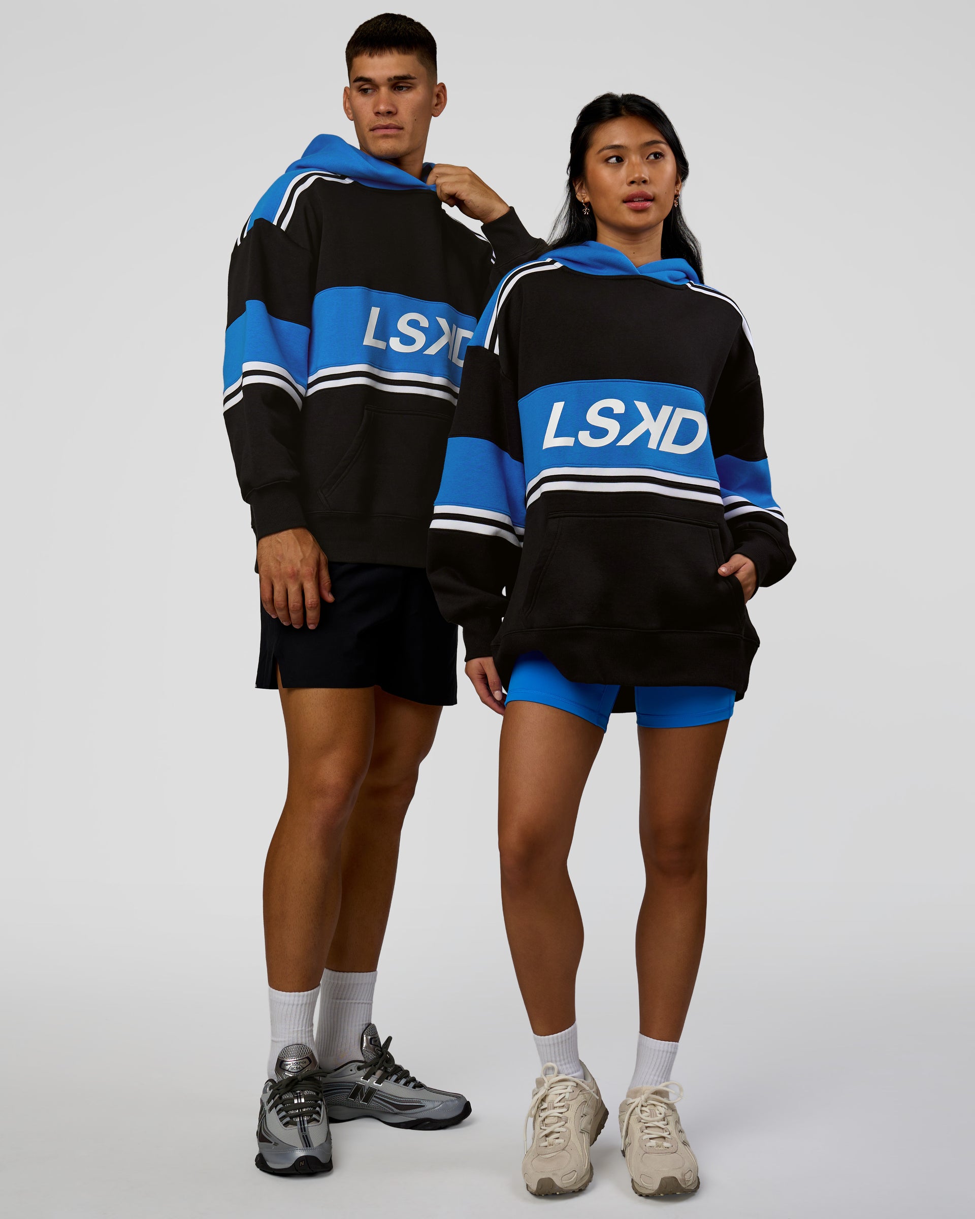 Duo wearing A-Team Oversized Hoodie - Caviar-Palace Blue | Model:Jackson | Size:L | Model:Loren | Size:XS