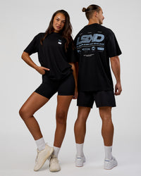 Duo wearing Archive FLXCotton Oversized Tee - Black-Open Air | Model:Both | Size:Duo | Thumbnail Index: 0