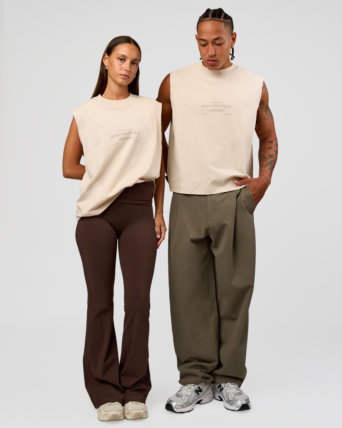 Duo wearing CF Unisex Oversized Heavyweight Boxed Tank - Clay-CF Move Through It | Model:Brylee | Size:XS | Model:Malebo | Size:M