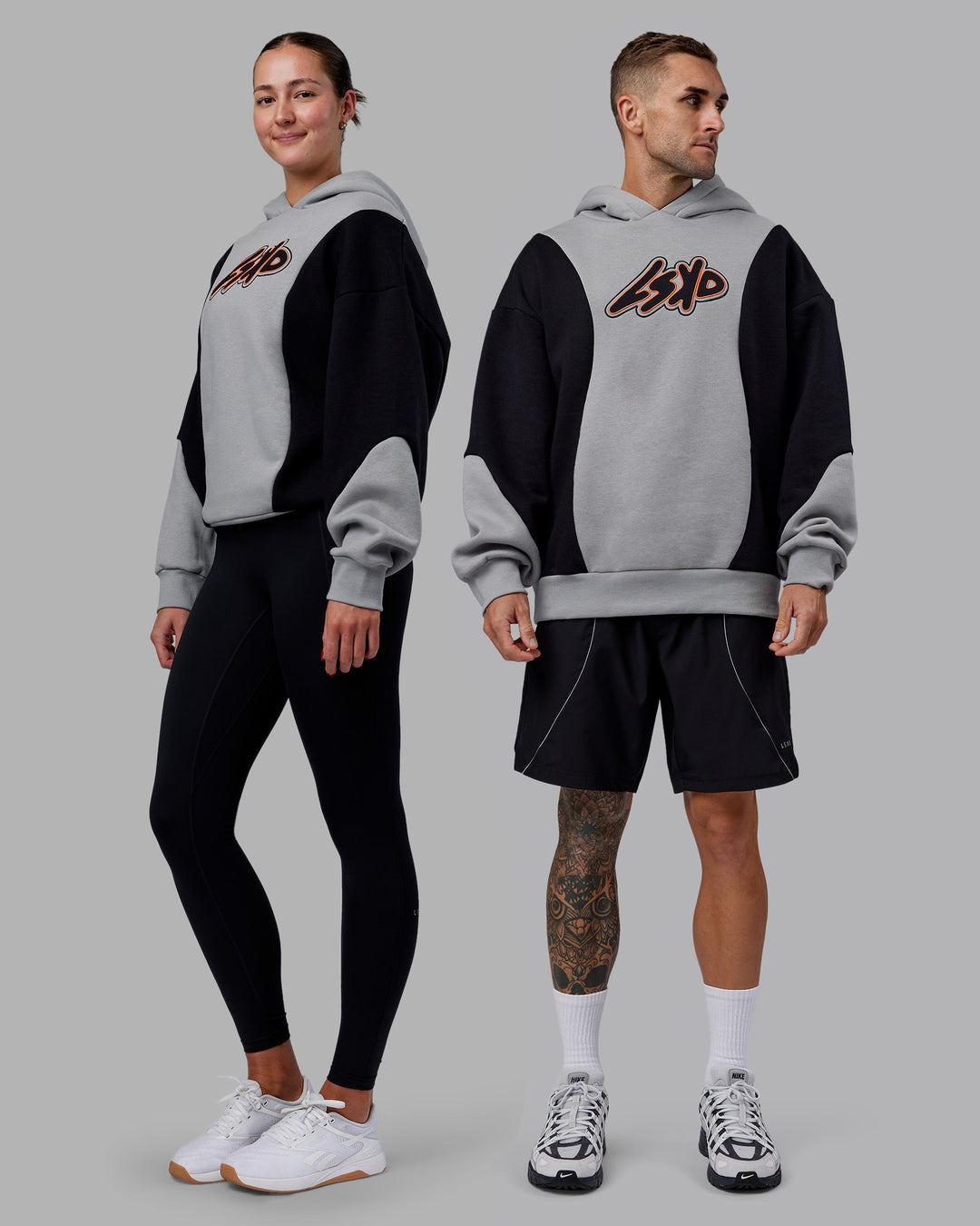 Duo wearing Downtown Oversized Panel Hoodie - Circular Grey - Black | Model:Both | Size:Duo - view 1