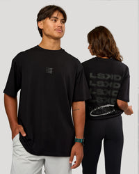 Duo wearing Everyday Elevation FLXCotton Oversized Tee - Black-Black | Model:Both | Size:Duo | Thumbnail Index: 0