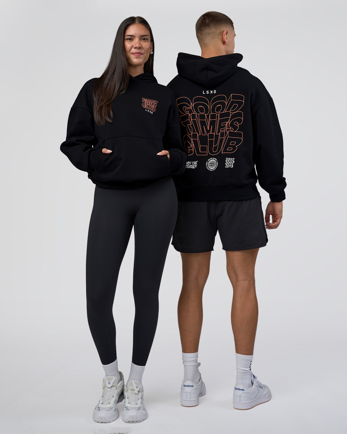 Duo wearing GTC CVC Fleece Unisex Oversized Hoodie - Black-Cantaloupe | Model:Both | Size:Duo