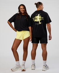 Duo wearing High Run FLXCotton Oversized Tee - Black-Yellow Fizz | Model:Both | Size:Duo | Thumbnail Index: 0