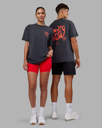 Duo wearing Inferno Journey FLXCotton Oversized Tee - Black Washed-Ultra Orange | Model:Both | Size:Duo | Thumbnail Index: 1